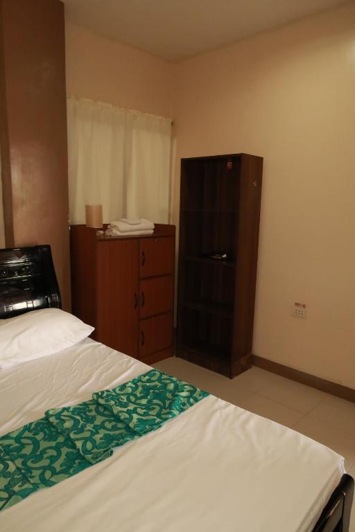 Postel nebo postele na pokoji v ubytování Jo-Cris Apartelle