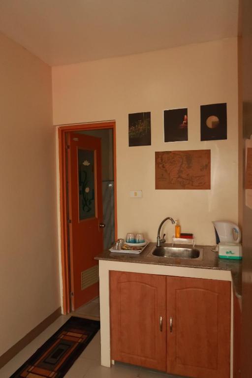 Kuchyň nebo kuchyňský kout v ubytování Jo-Cris Apartelle