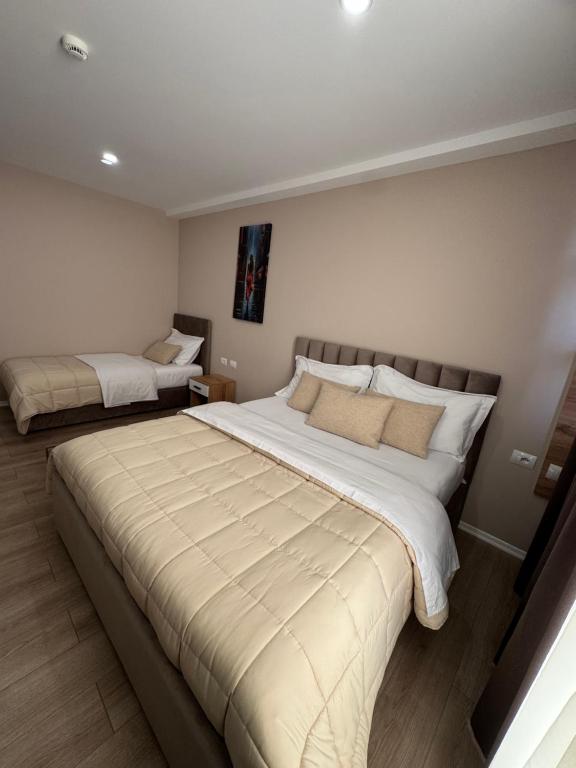 Postel nebo postele na pokoji v ubytování RoRa Studio Apartments