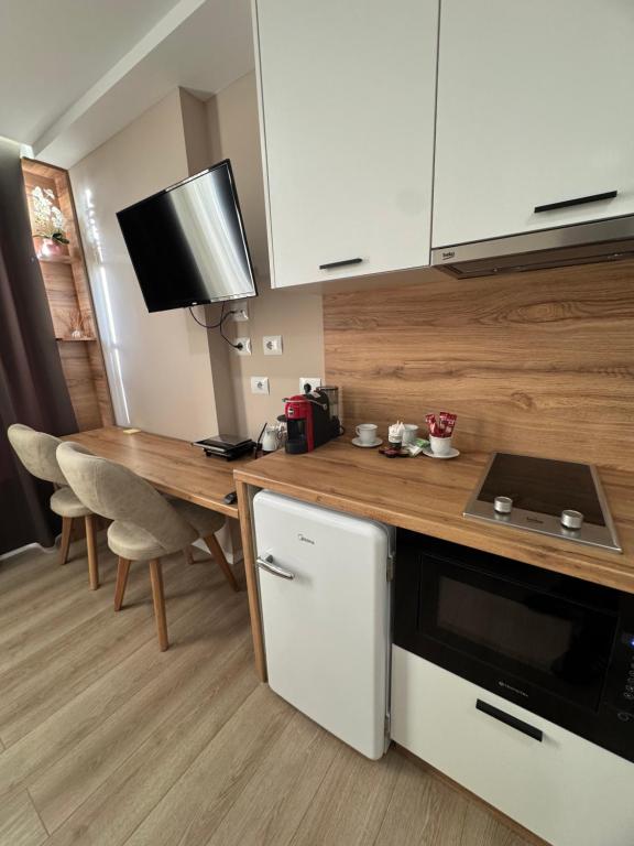 Kuchyň nebo kuchyňský kout v ubytování RoRa Studio Apartments