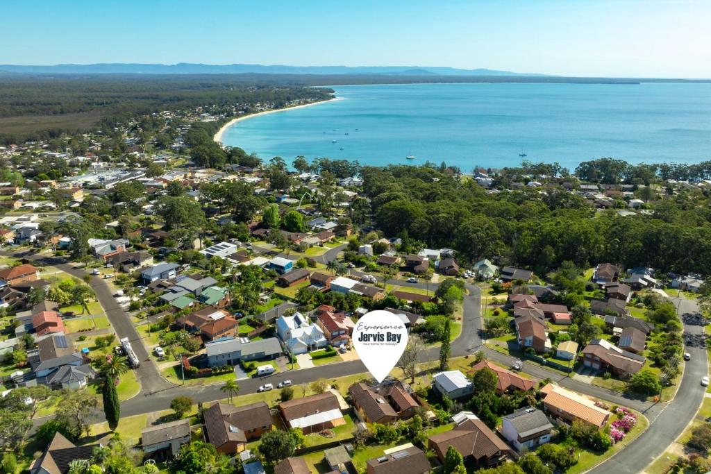 an aerial view of a town next to the ocean at Colloden Beach House by Experience Jervis Bay in Vincentia