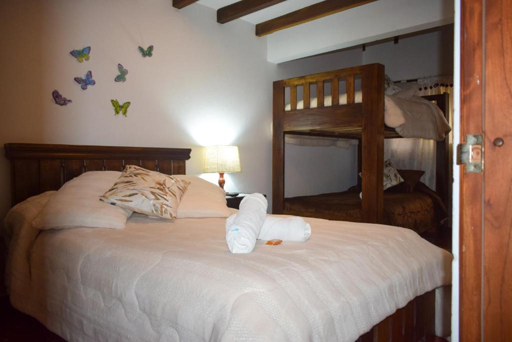 Postel nebo postele na pokoji v ubytování Apartahotel saquenzipá