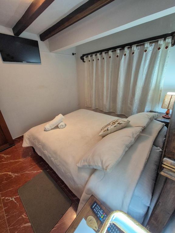 Postel nebo postele na pokoji v ubytování Apartahotel saquenzipá