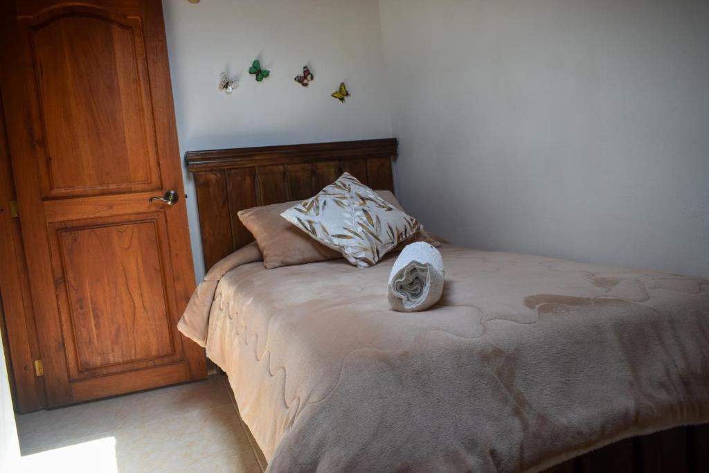 Postel nebo postele na pokoji v ubytování Apartahotel saquenzipá