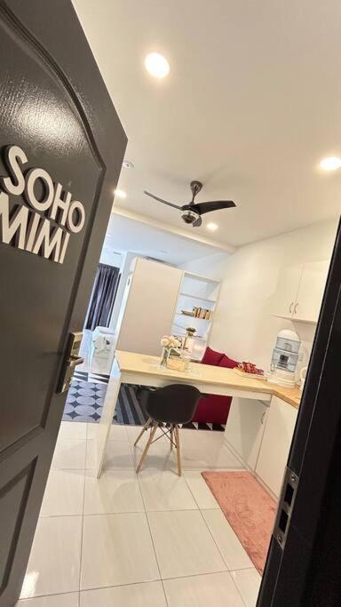 a office with a desk and a chair in a room at SohoMimi Seri Iskandar in Kampung Bota Kiri