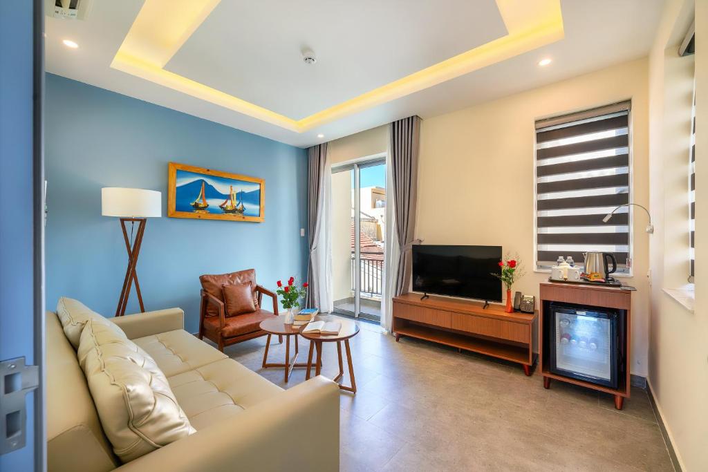 TV a/nebo společenská místnost v ubytování Full Moon Apartments & Villa - Hoi An