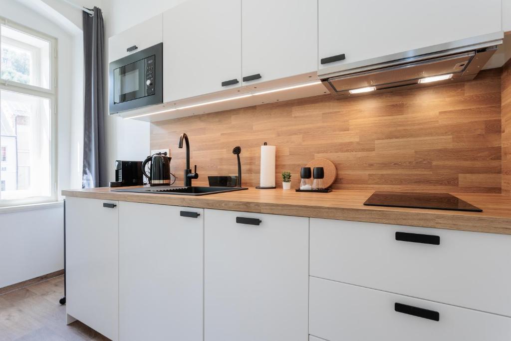 Kuchyň nebo kuchyňský kout v ubytování Apartmány Stříbrná Liška
