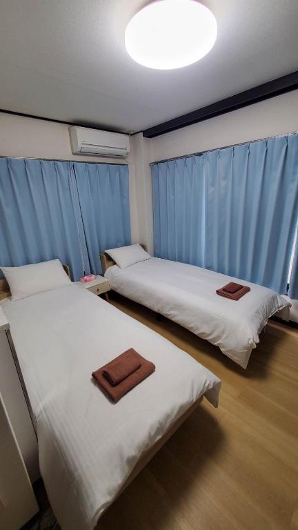 Postel nebo postele na pokoji v ubytování Uhome Tabata Apartment