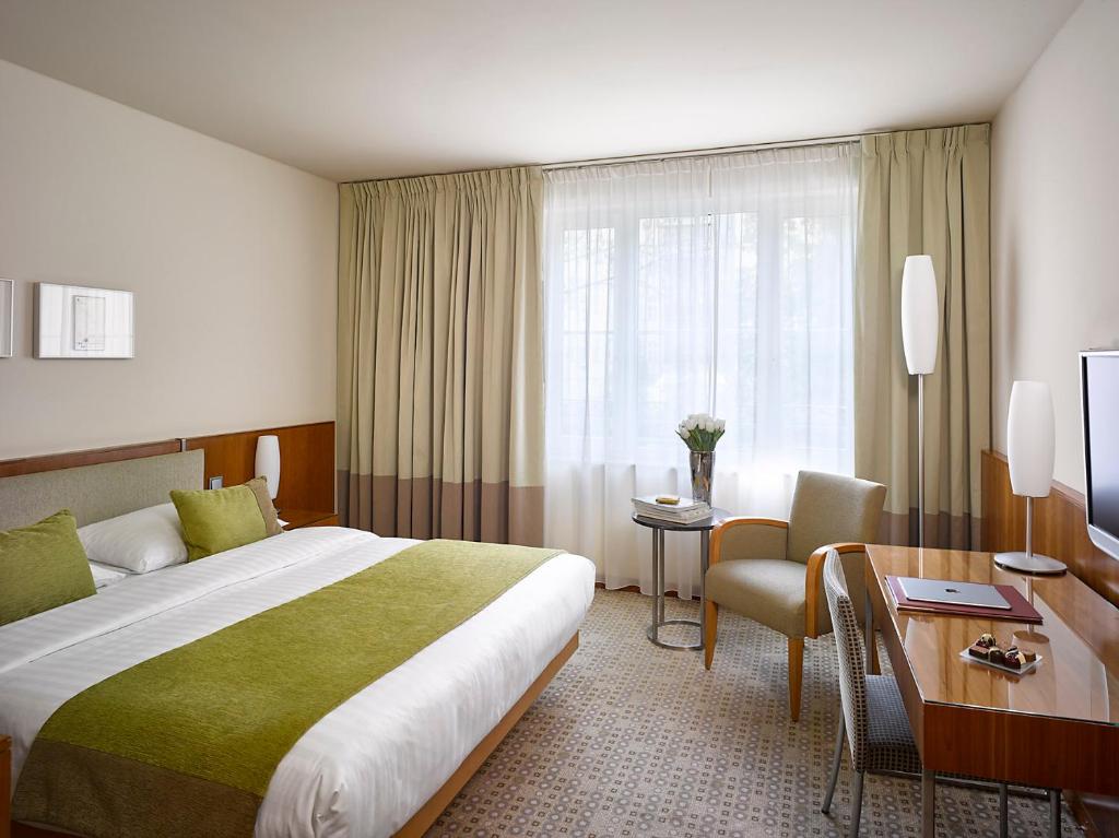 Postel nebo postele na pokoji v ubytování K+K Hotel Central