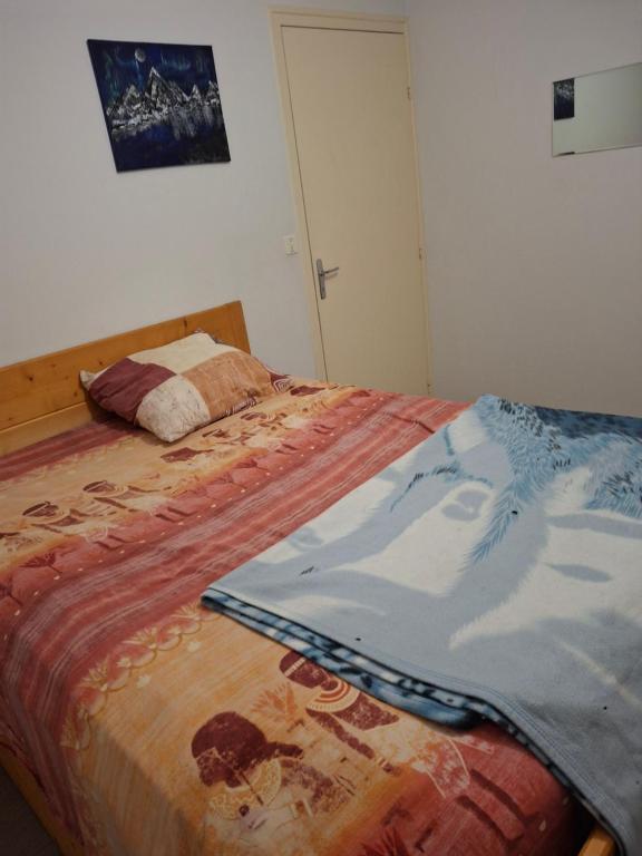 Postel nebo postele na pokoji v ubytování Nid douillet