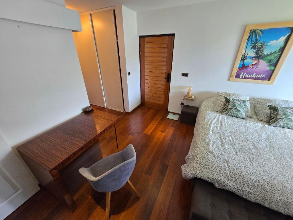 Postel nebo postele na pokoji v ubytování TITOU LODGE - Hauteurs de Miri
