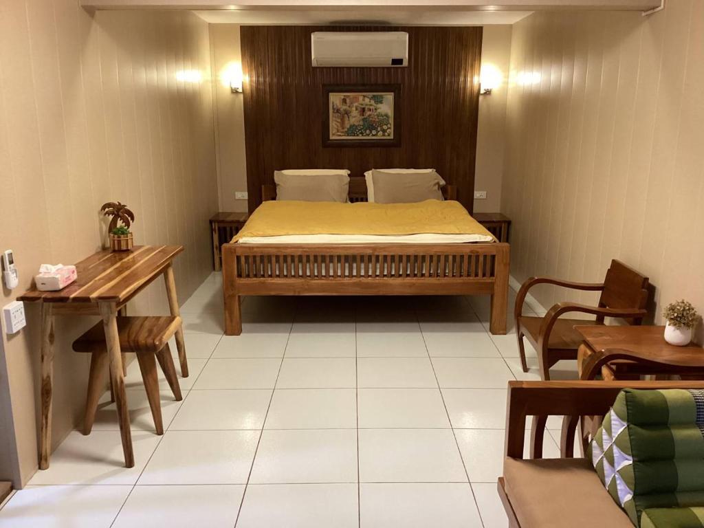Postel nebo postele na pokoji v ubytování Baan Khunsri Guesthouse