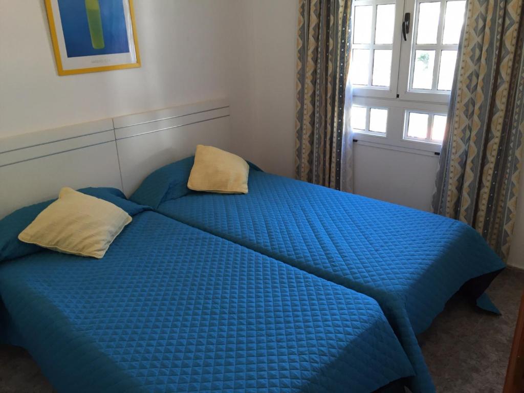 Postel nebo postele na pokoji v ubytování Casa Reyes Fataga
