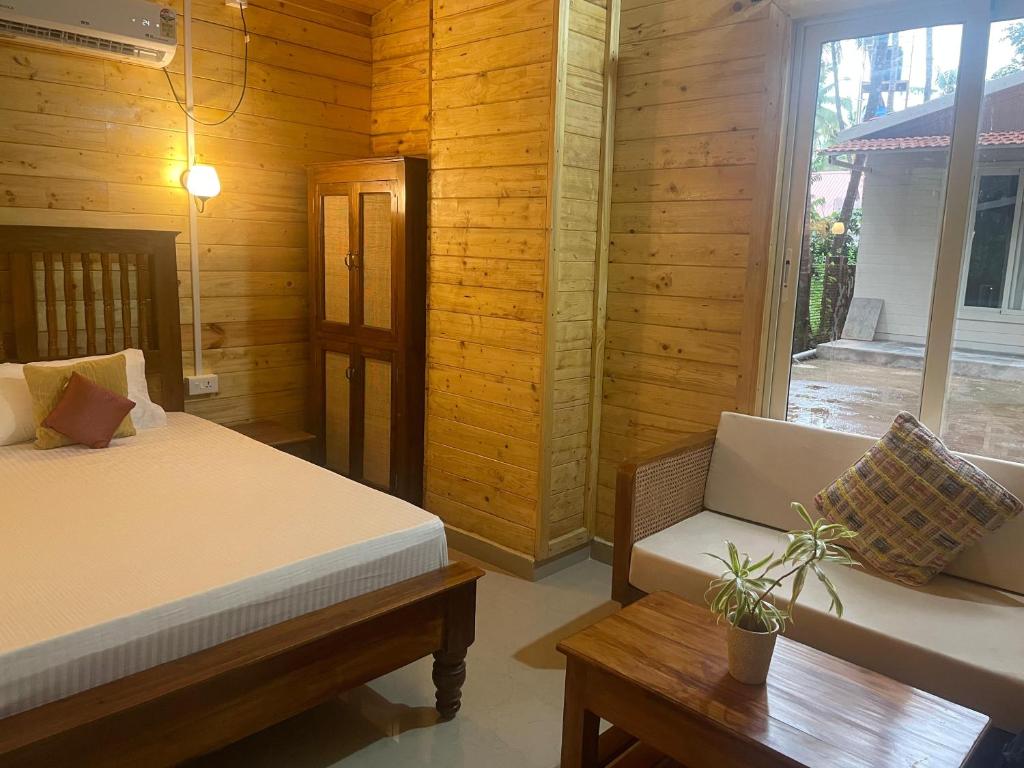 Postel nebo postele na pokoji v ubytování The Mild Goa