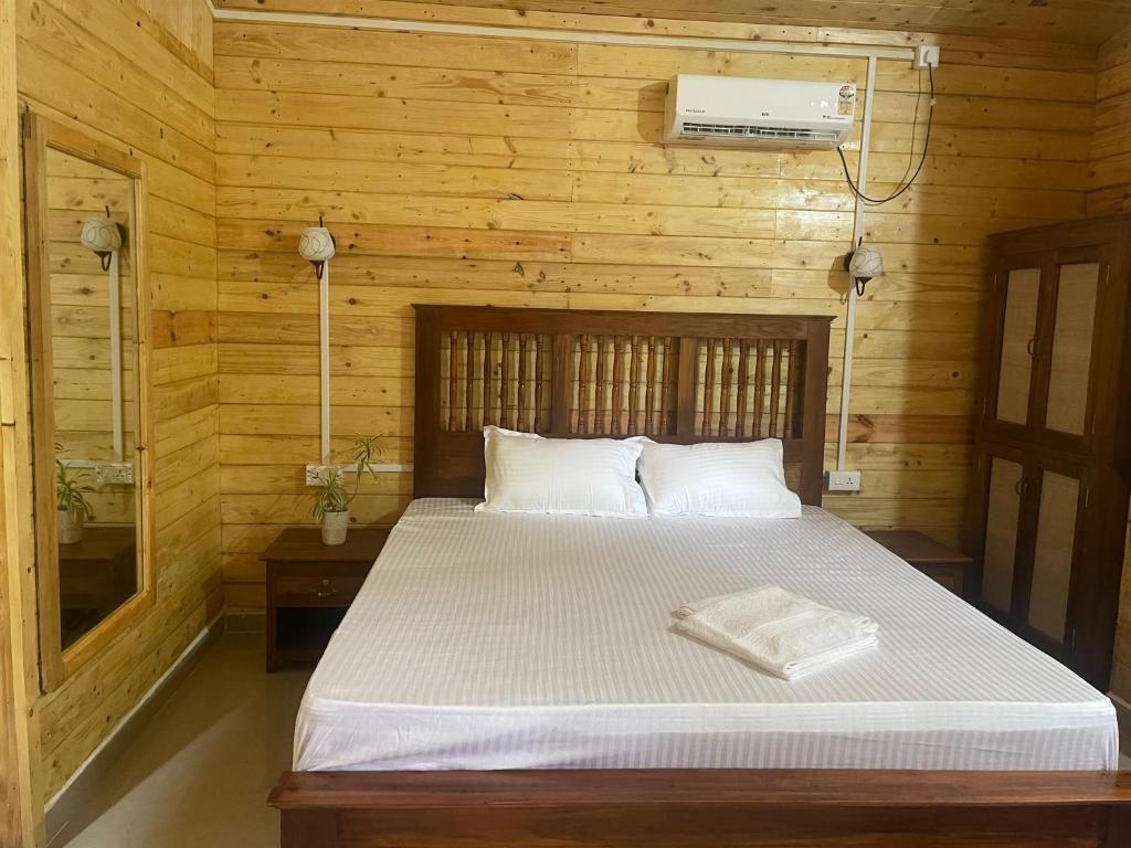 Postel nebo postele na pokoji v ubytování The Mild Goa