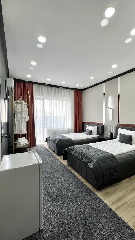 Postel nebo postele na pokoji v ubytování Suncor Hotel
