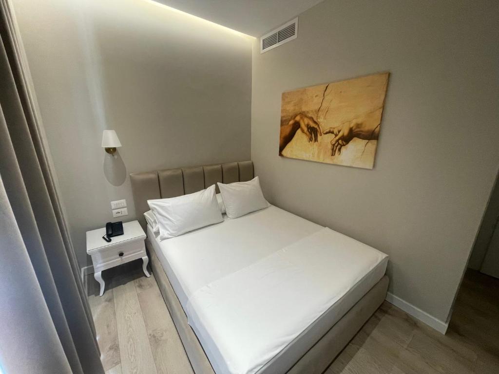 Postel nebo postele na pokoji v ubytování Seaside Hotel