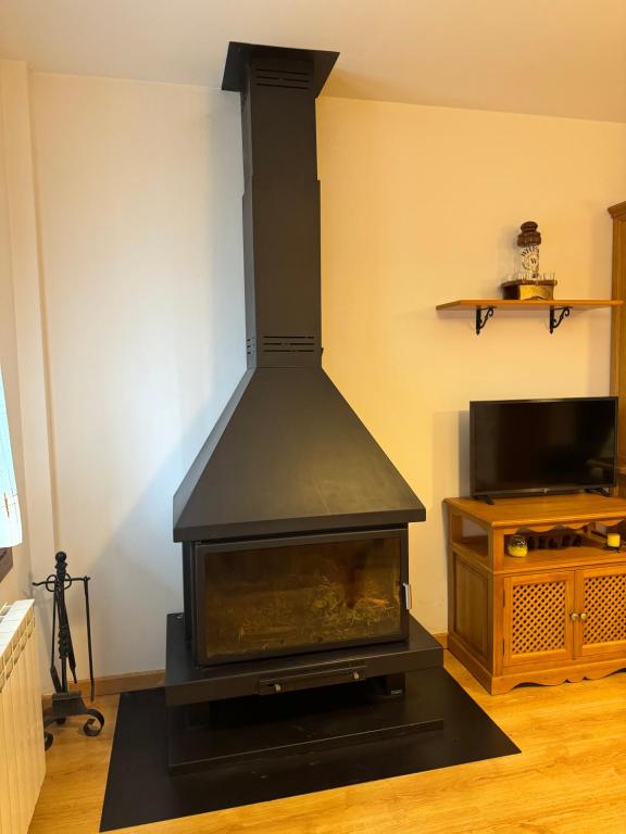 TV a/nebo společenská místnost v ubytování Apartamento La Calma