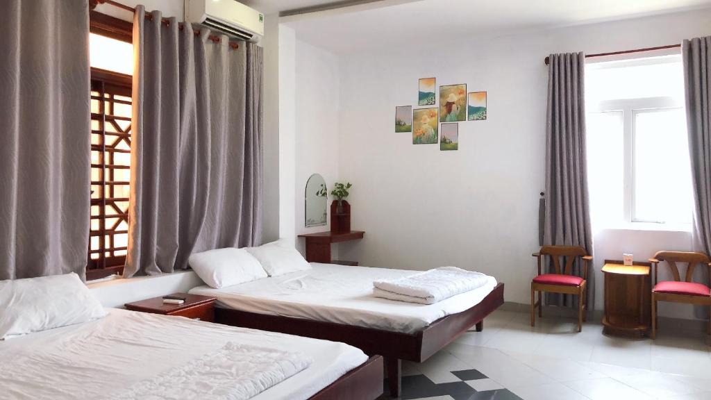 Postel nebo postele na pokoji v ubytování Motel Minh Thảo