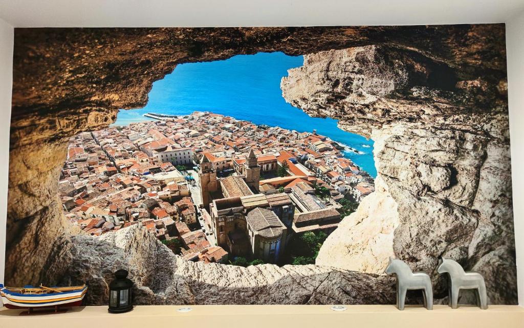 a view of a city from a cave at Antoinette Maison in Cefalù