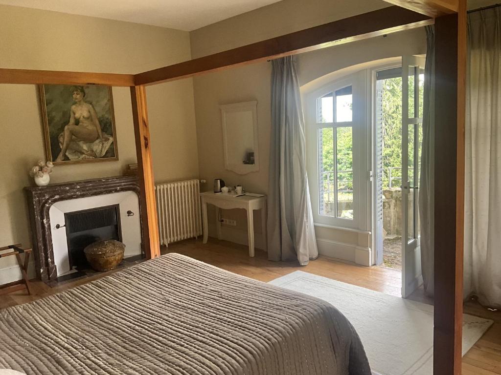 Postel nebo postele na pokoji v ubytování Chateau Tout Y Fault