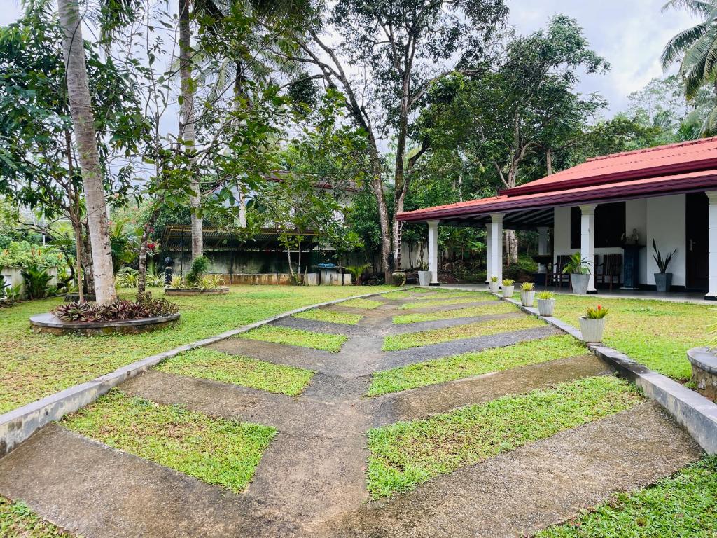 a walkway in the yard of a house at The Villa in Massalapitiya