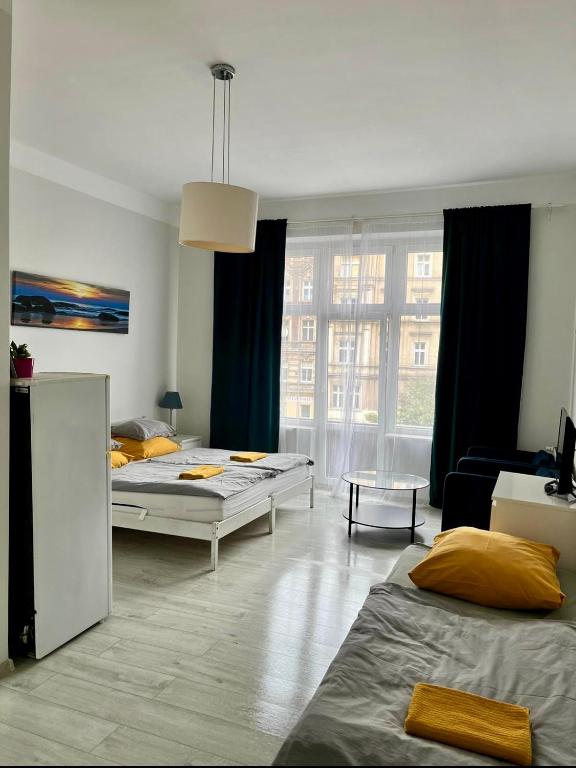 Posteľ alebo postele v izbe v ubytovaní Colourful Rooms Wrocław