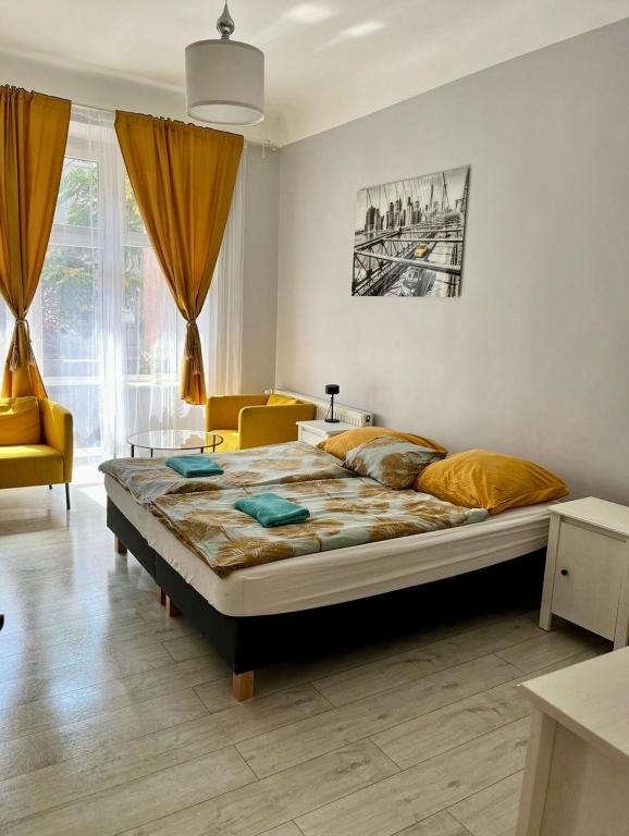 Posteľ alebo postele v izbe v ubytovaní Colourful Rooms Wrocław