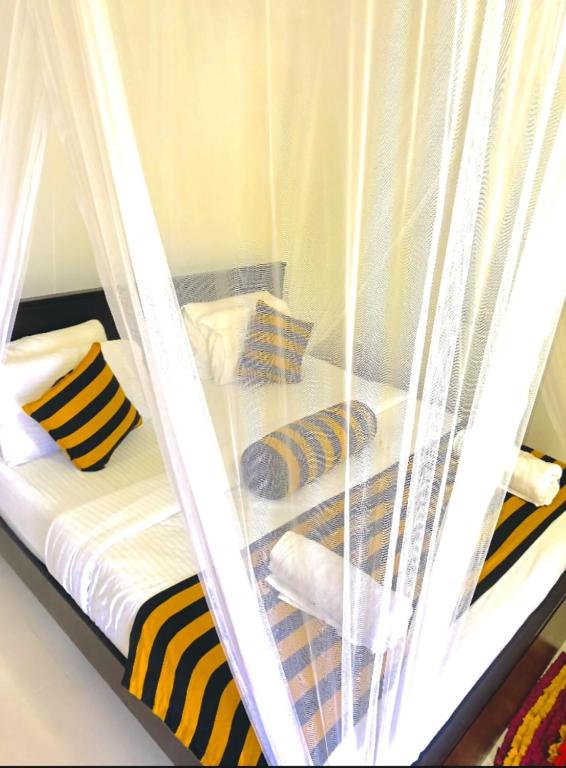 Postel nebo postele na pokoji v ubytování Sadew Home Stay