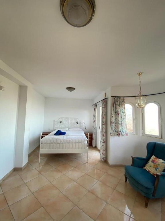 Postel nebo postele na pokoji v ubytování Villa El Castillo