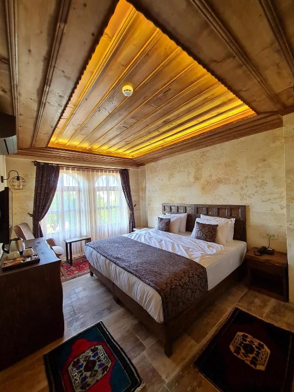 Postel nebo postele na pokoji v ubytování Flavia Cappadocia Hotel
