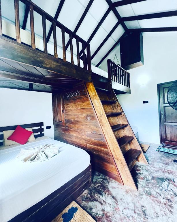 Postel nebo postele na pokoji v ubytování Roy's Villa
