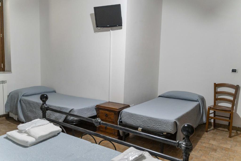 Postel nebo postele na pokoji v ubytování Agriturismo B&B La Sterpina