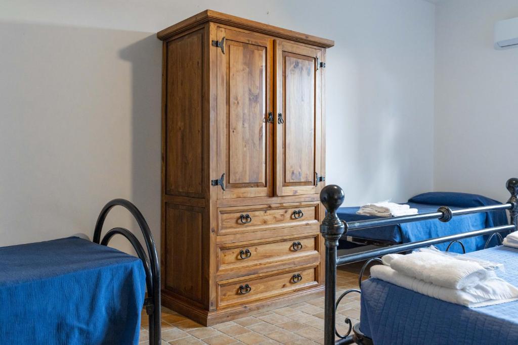 Postel nebo postele na pokoji v ubytování Agriturismo B&B La Sterpina
