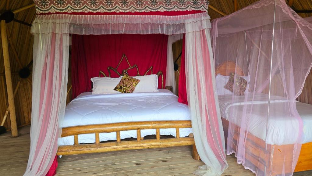 Postel nebo postele na pokoji v ubytování Paradise Eco-Hub