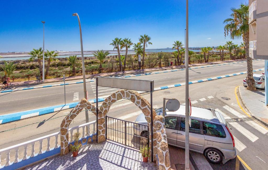 ein Lieferwagen, der auf einem Parkplatz neben einer Straße geparkt ist in der Unterkunft Cozy Apartment In San Pedro Del Pinatar in San Pedro del Pinatar