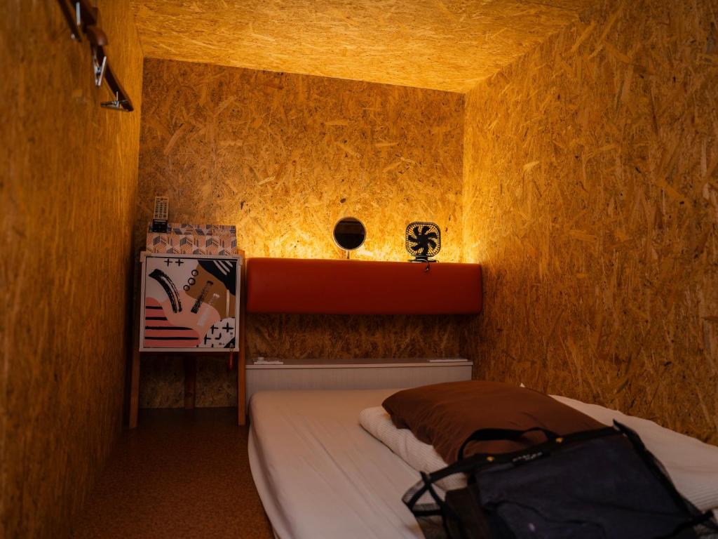 Postel nebo postele na pokoji v ubytování eeGee STAY Kamata