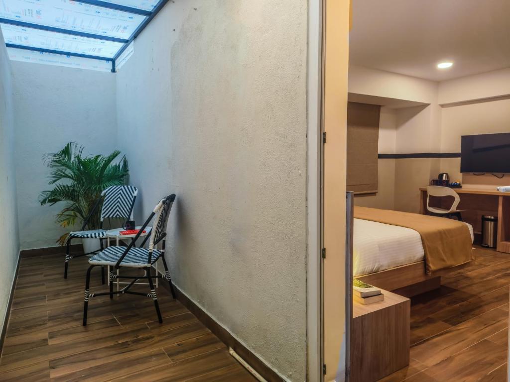 Postel nebo postele na pokoji v ubytování Olive Hotel Millers Road by Embassy Group