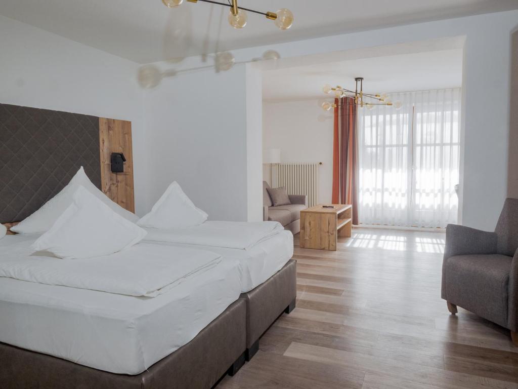 Postel nebo postele na pokoji v ubytování Hotel Geiger