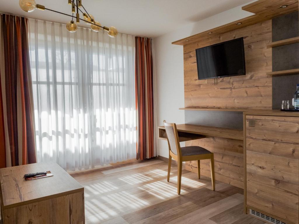 TV a/nebo společenská místnost v ubytování Hotel Geiger