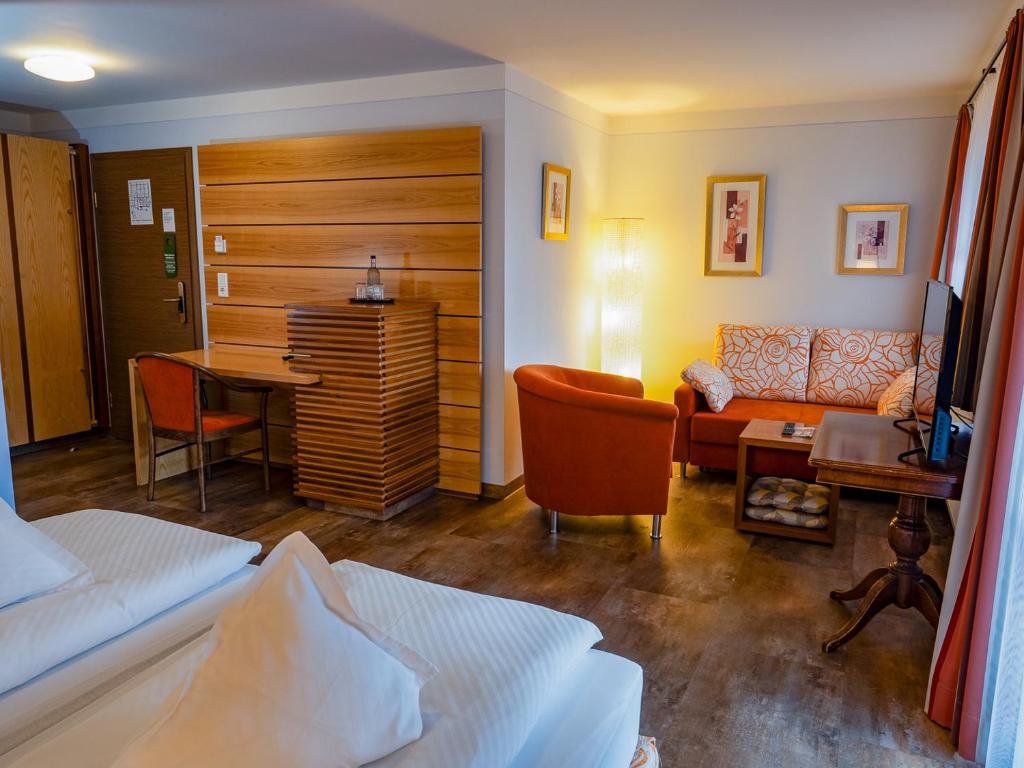 Postel nebo postele na pokoji v ubytování Hotel Geiger