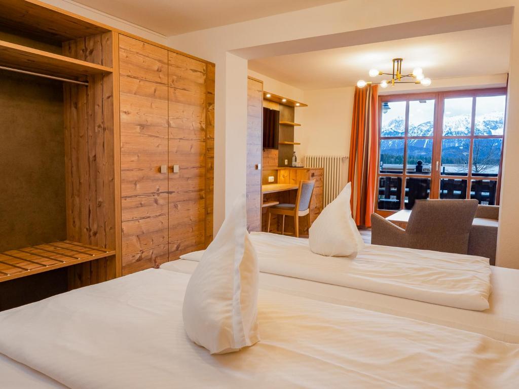 Postel nebo postele na pokoji v ubytování Hotel Geiger