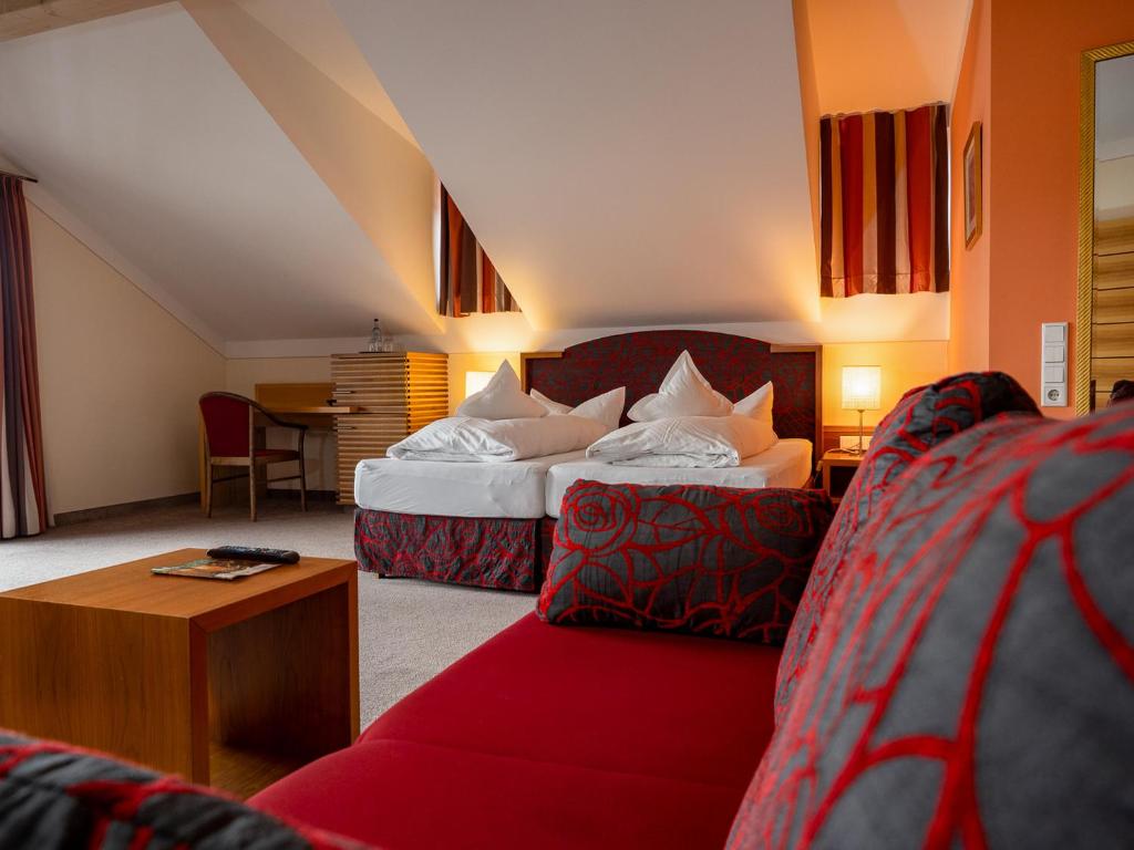 Postel nebo postele na pokoji v ubytování Hotel Geiger