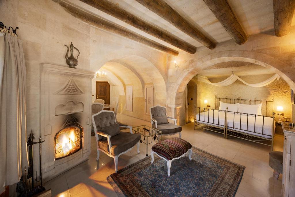 A bed or beds in a room at Tafoni Houses Cave Hotel