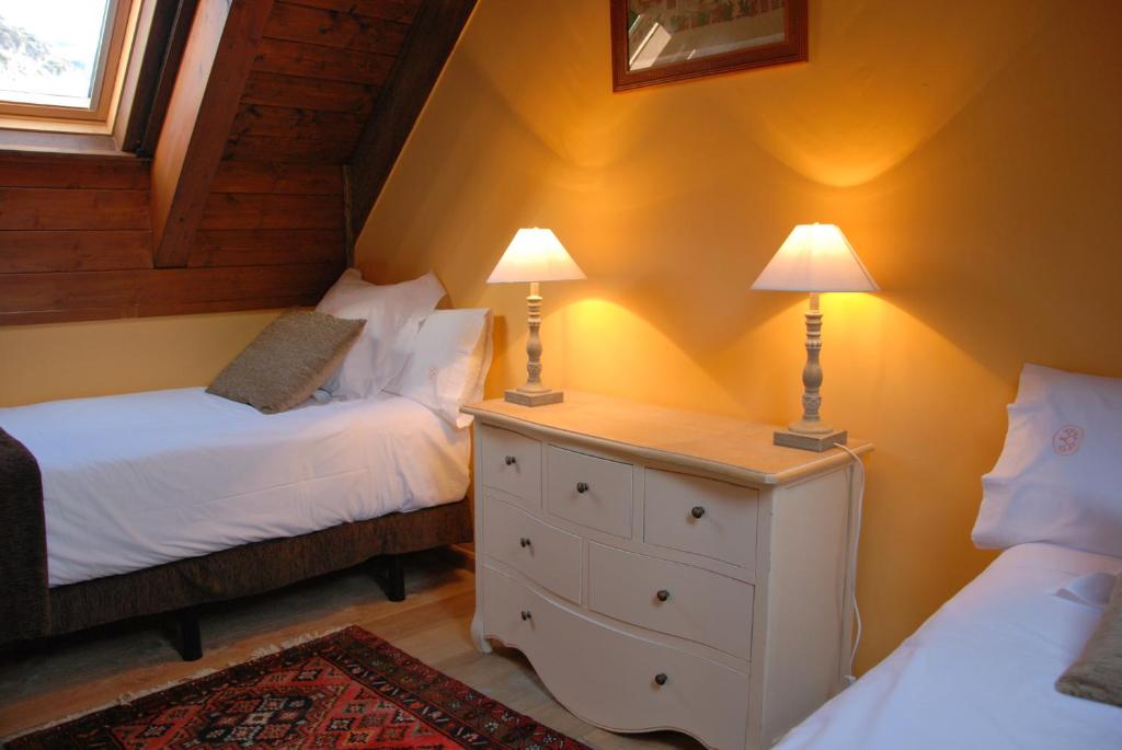 Postel nebo postele na pokoji v ubytování Hotel Selba d'Ansils