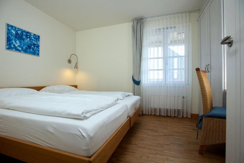 Postel nebo postele na pokoji v ubytování Hapimag Resort Dünenblick
