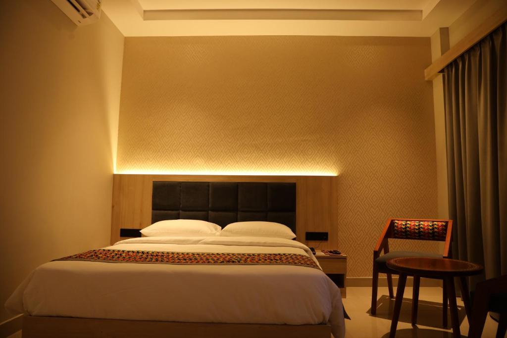 Postel nebo postele na pokoji v ubytování The Citi Residenci Hotel, Banskopa