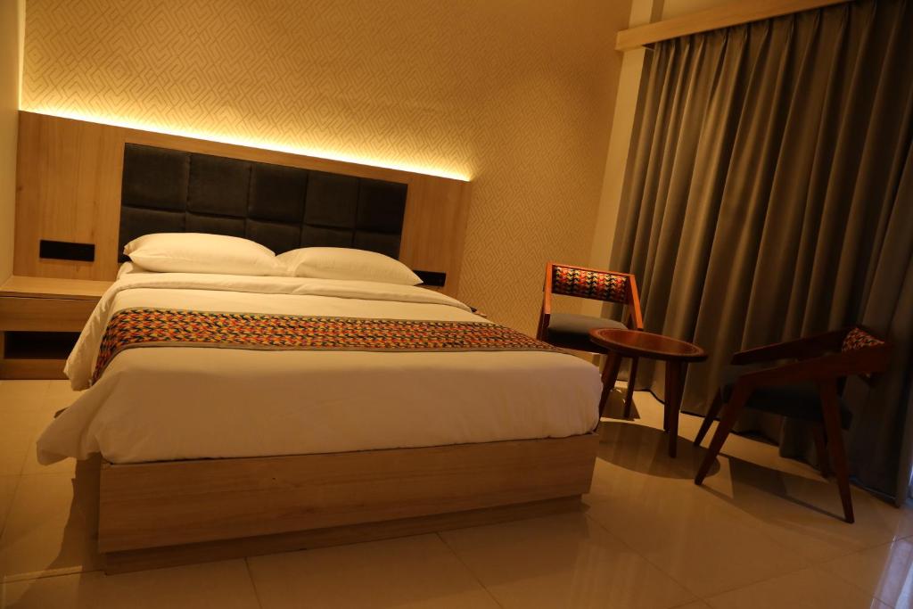 Postel nebo postele na pokoji v ubytování The Citi Residenci Hotel, Banskopa