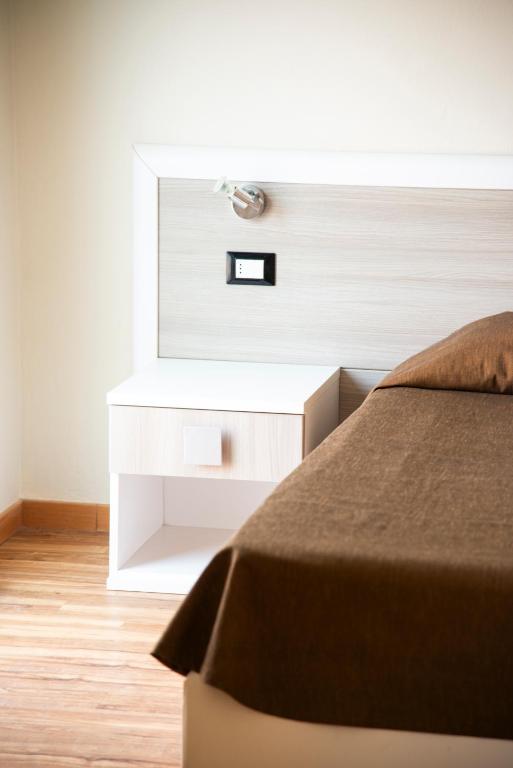 Postel nebo postele na pokoji v ubytování Hotel Fabricia