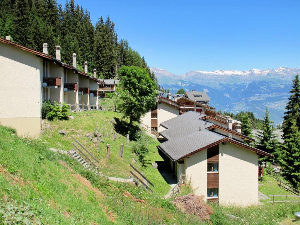 a group of buildings on the side of a hill at Chalet Fuchsia by Interhome in Les Collons